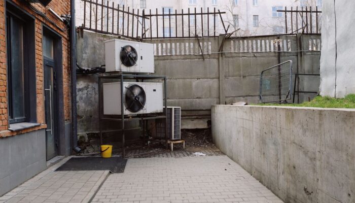 Outdoor HVAC air conditioning unit affecting indoor humidity