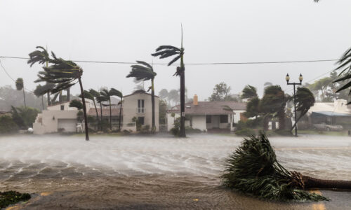 Hurricane winds and rain striking a coastal neighborhood – why pre-storm documentation matters before the season peaks