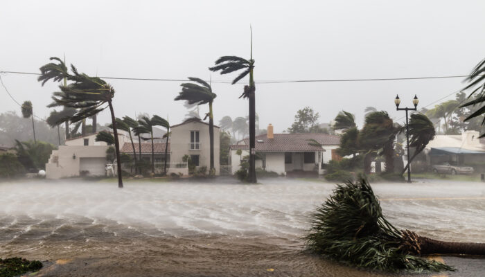 Hurricane winds and rain striking a coastal neighborhood – why pre-storm documentation matters before the season peaks